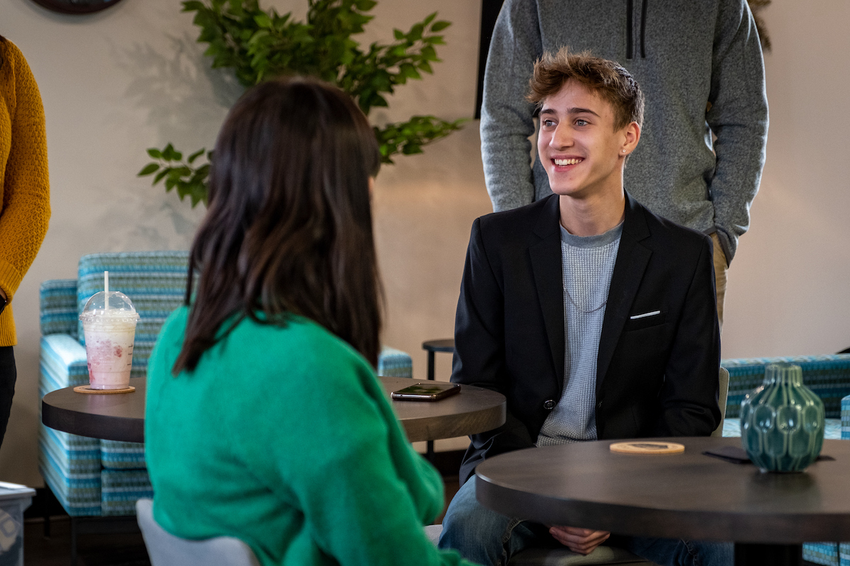 Person meeting with colleagues