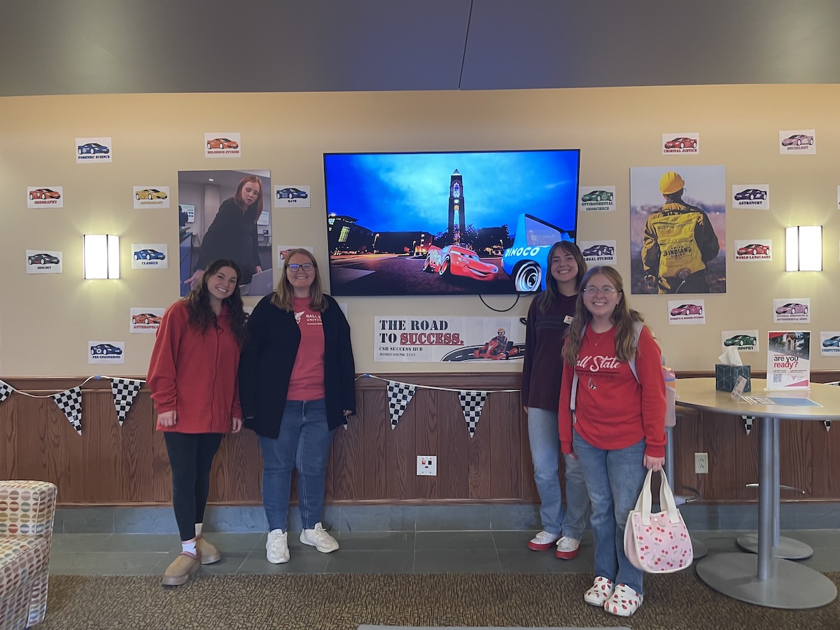 people in front of TV playing Cars the Movie