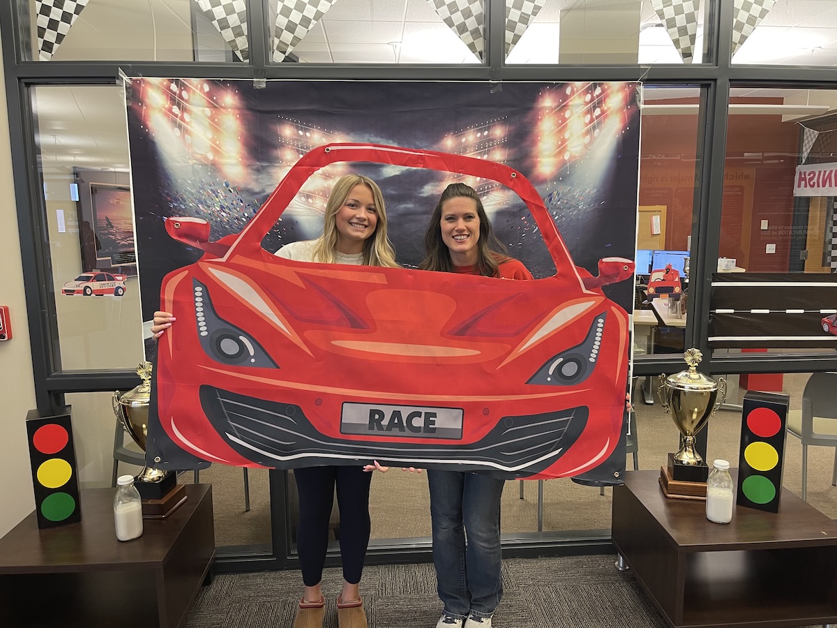 two females in red car cutout