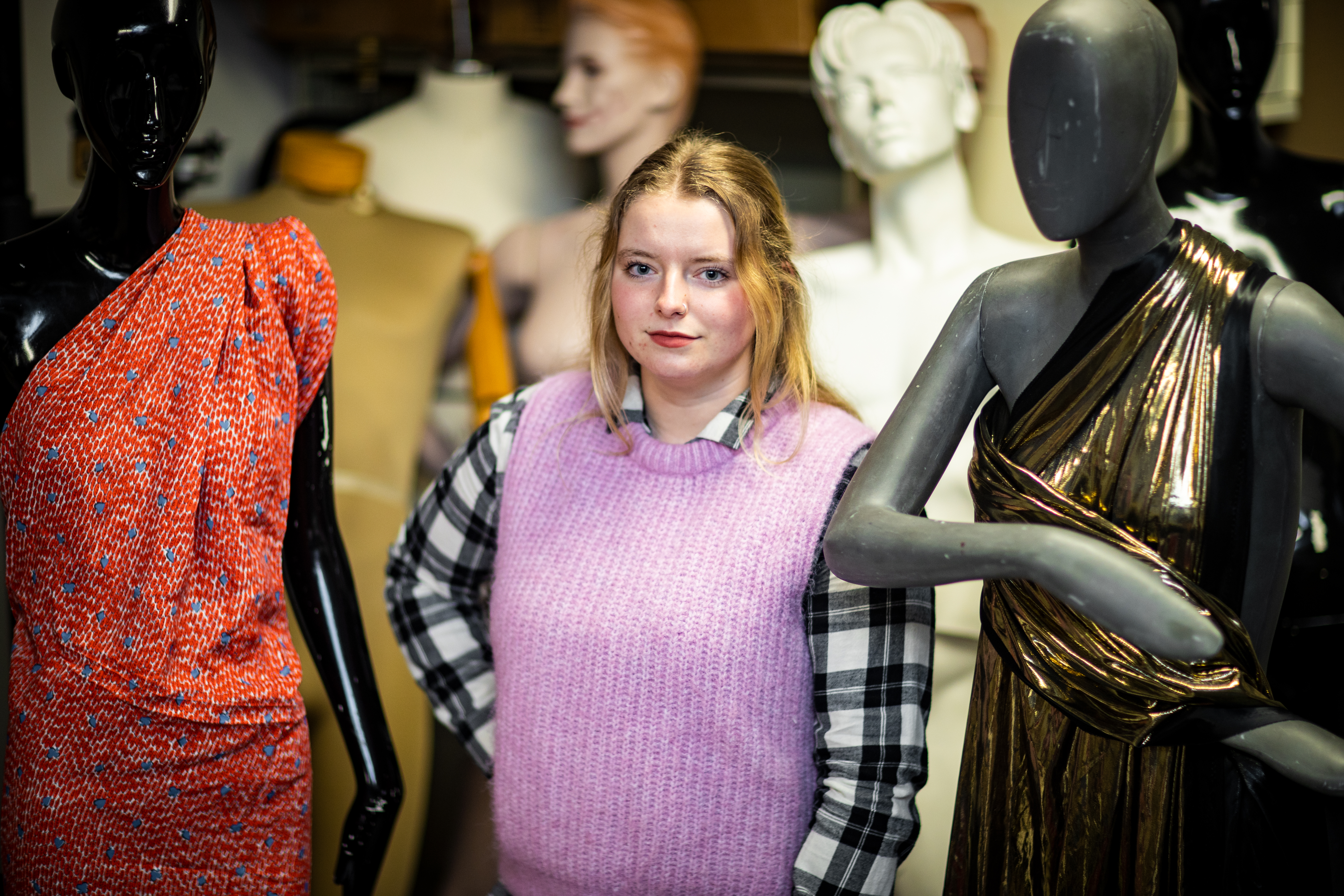 student with mannequins 