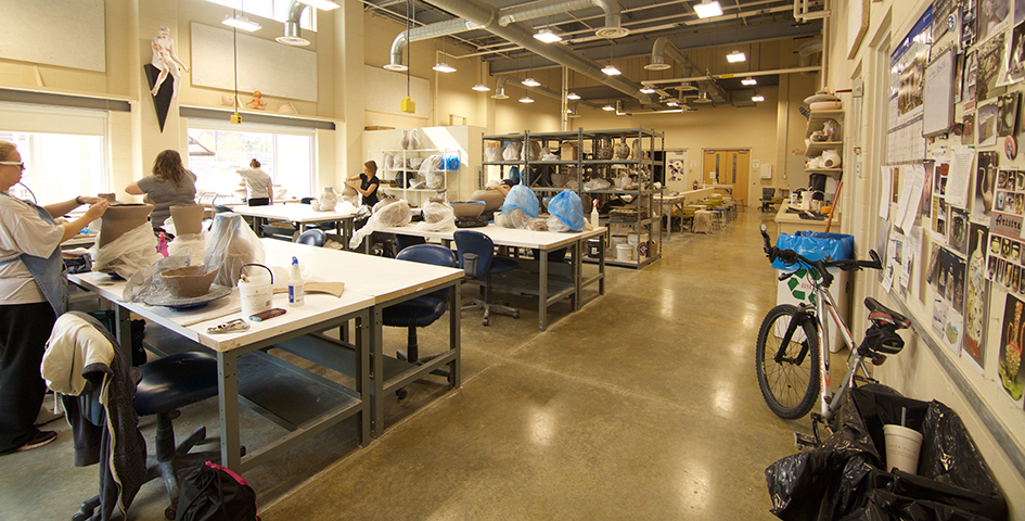 ceramics lab with students working on projects