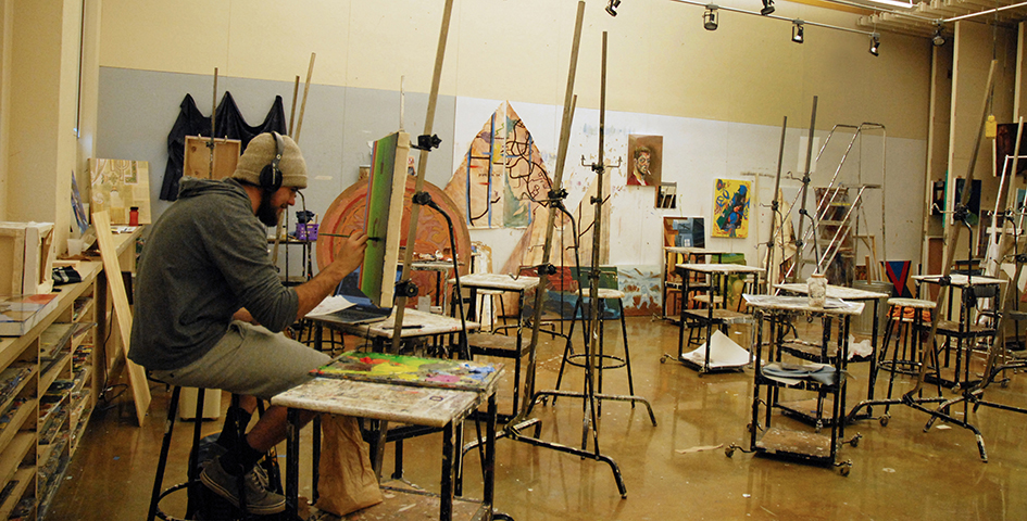 student painting in a studio