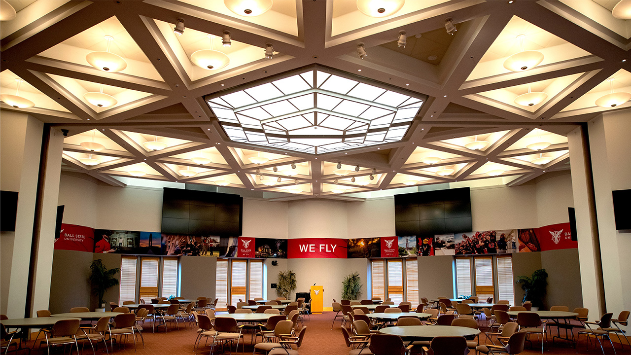 Hall with glass roof and tables and chairs set up