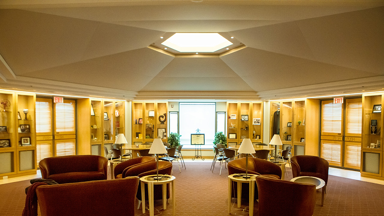 Room with comfy leather chairs and lamps.