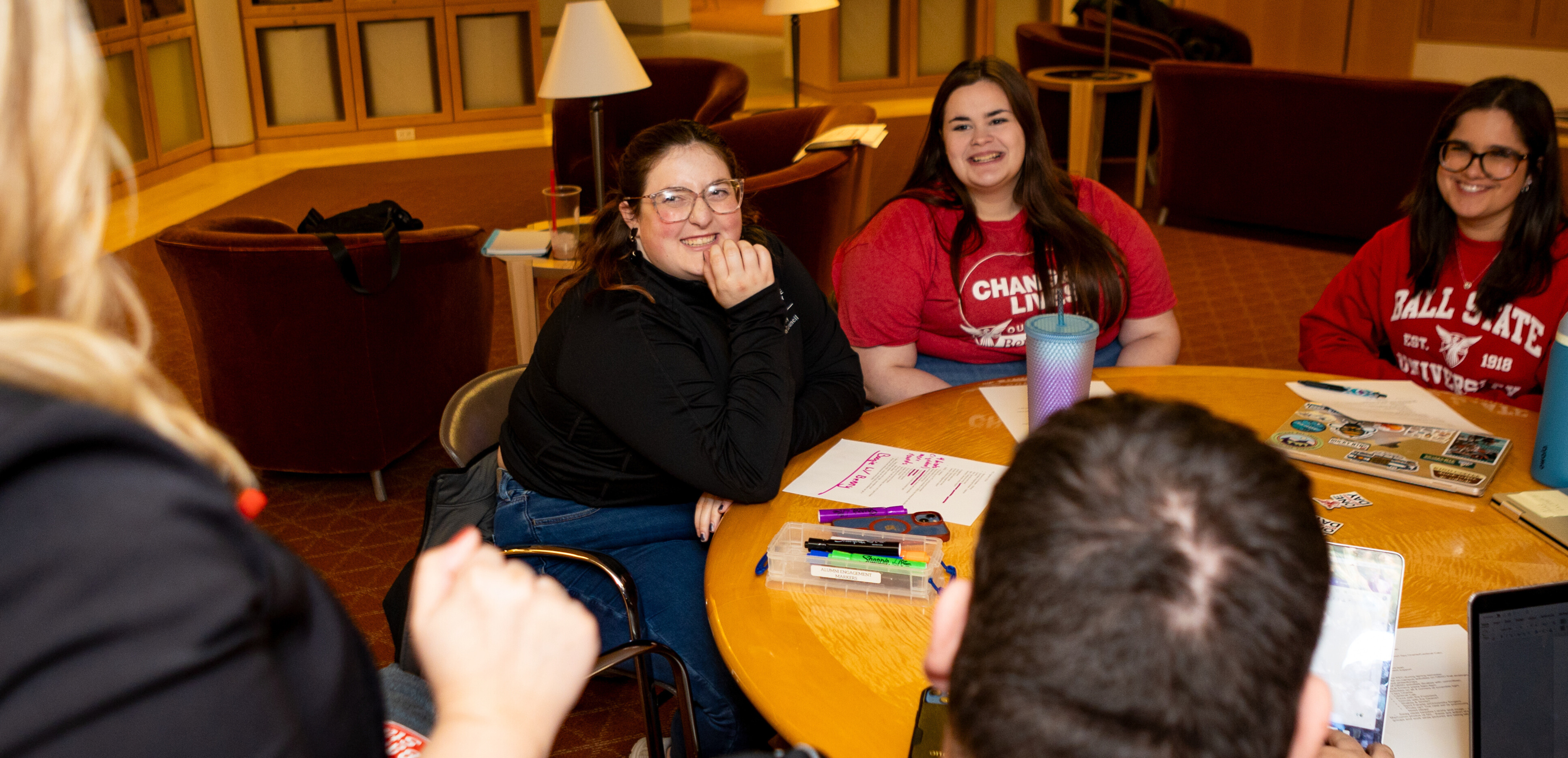 Students talking in the Alumni Center library