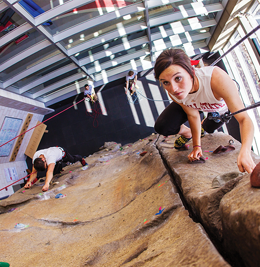 A student on the climbing wall