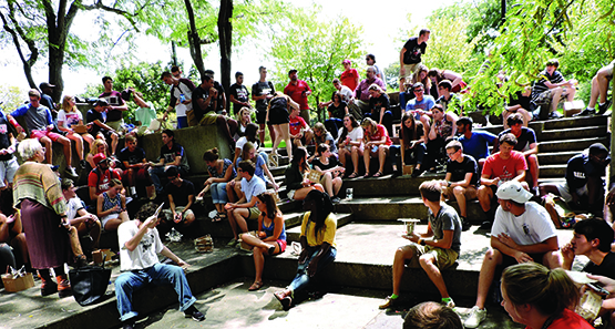 Students during a class on the steps of the sunken patio