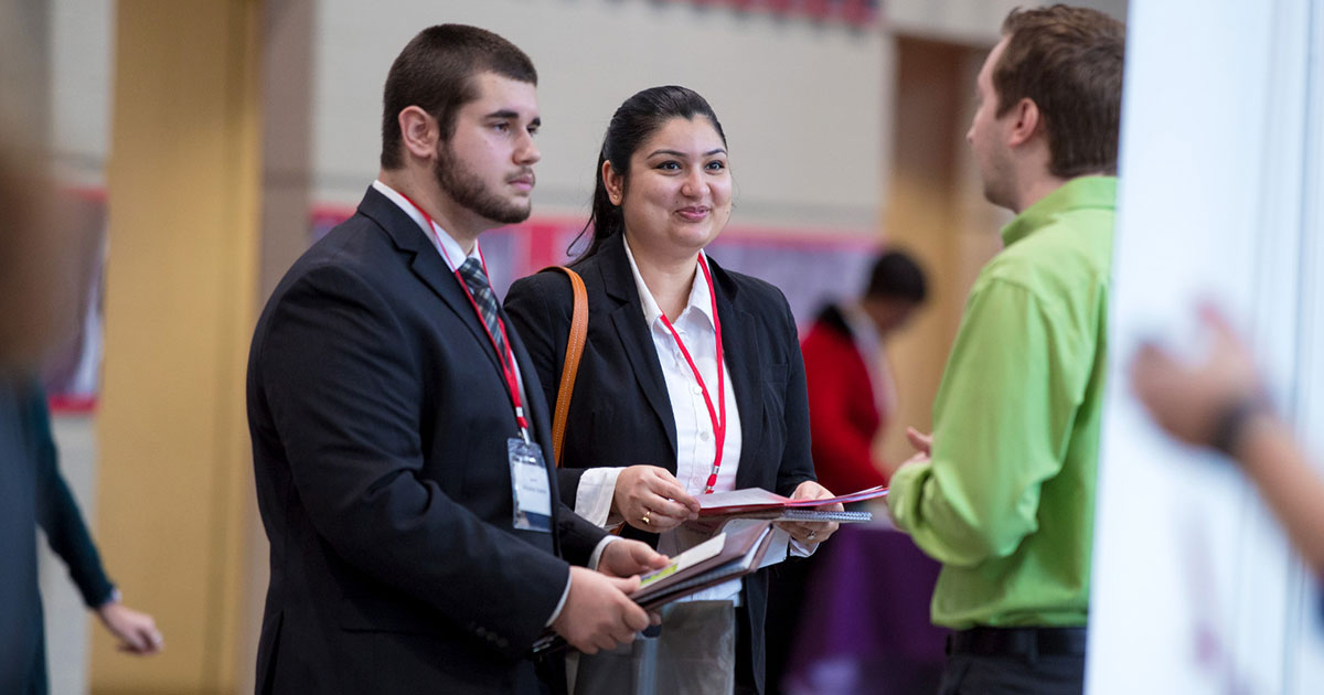 Students speak with employer