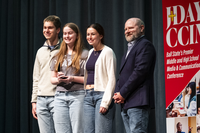Students accepting an award at the conference