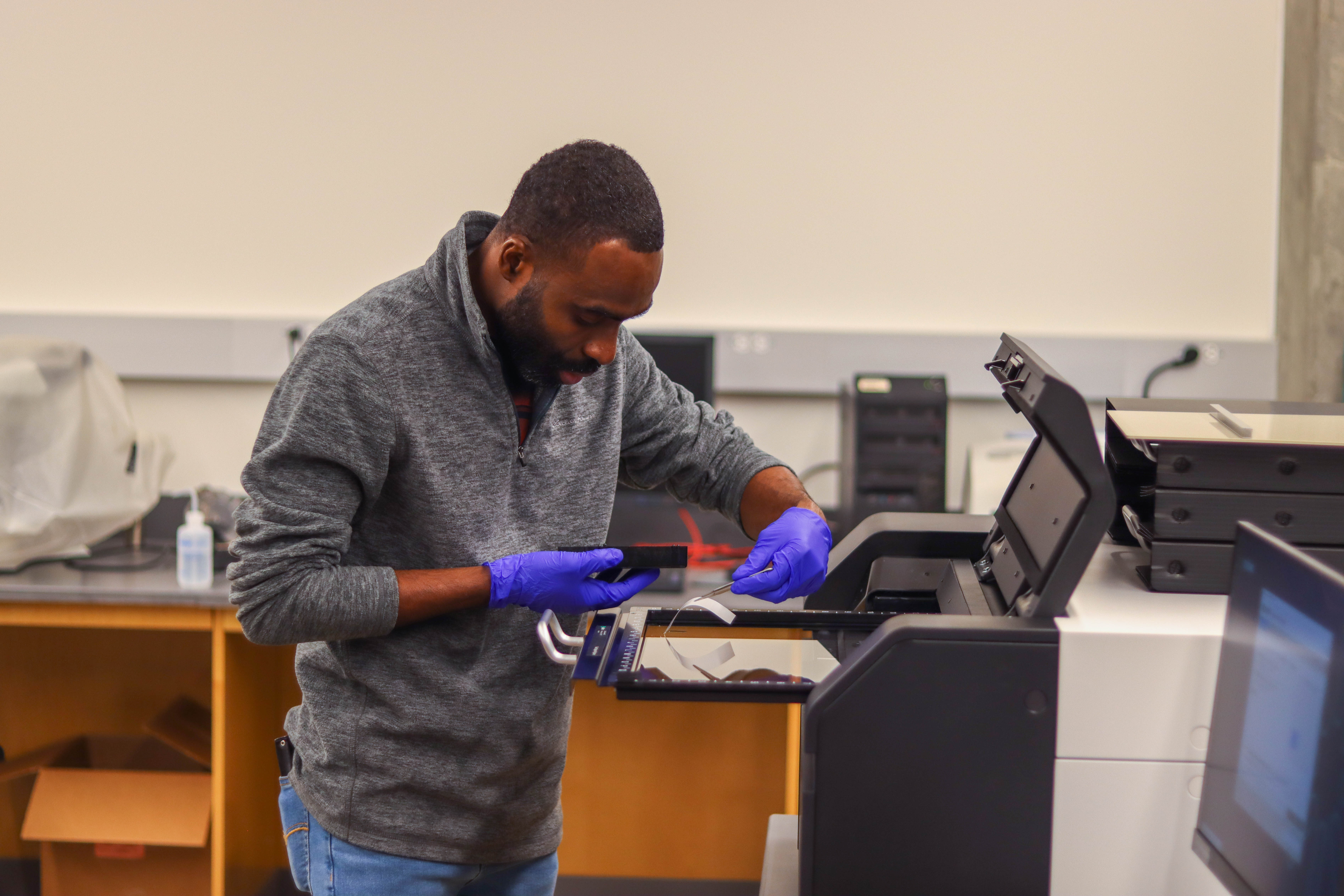A student places RNA molecules on the Typhoon scanner