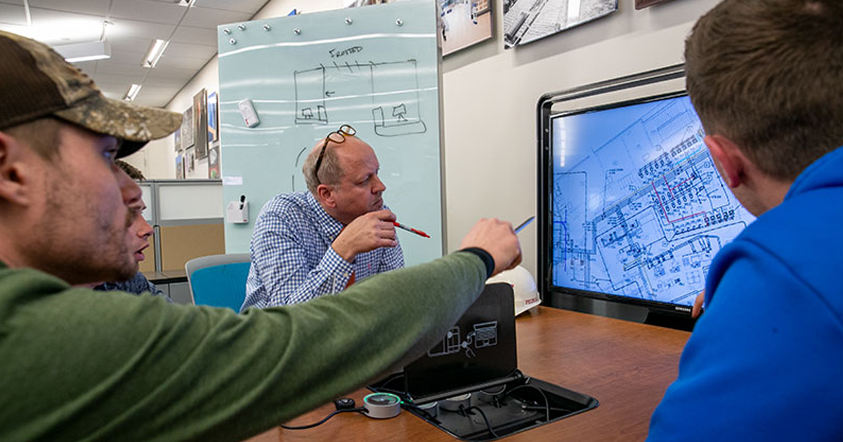 Professor works with student