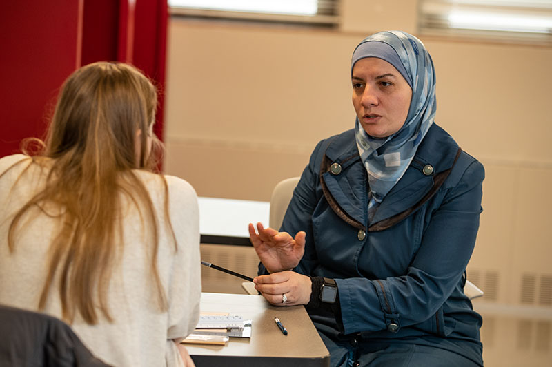 Professor talking with student