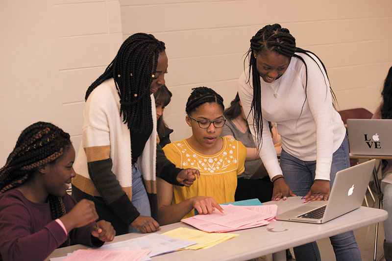 a group of CPSPC students working together.