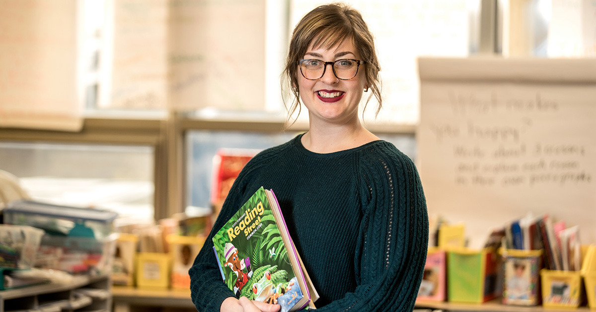 Teacher holding a book