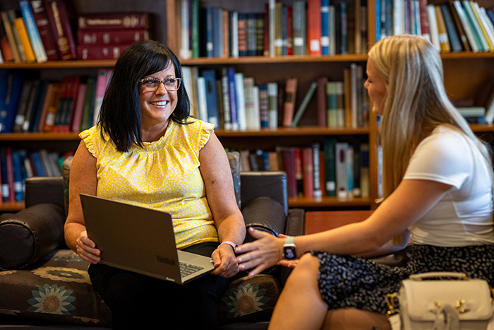 Educational Leadership students sitting in a library