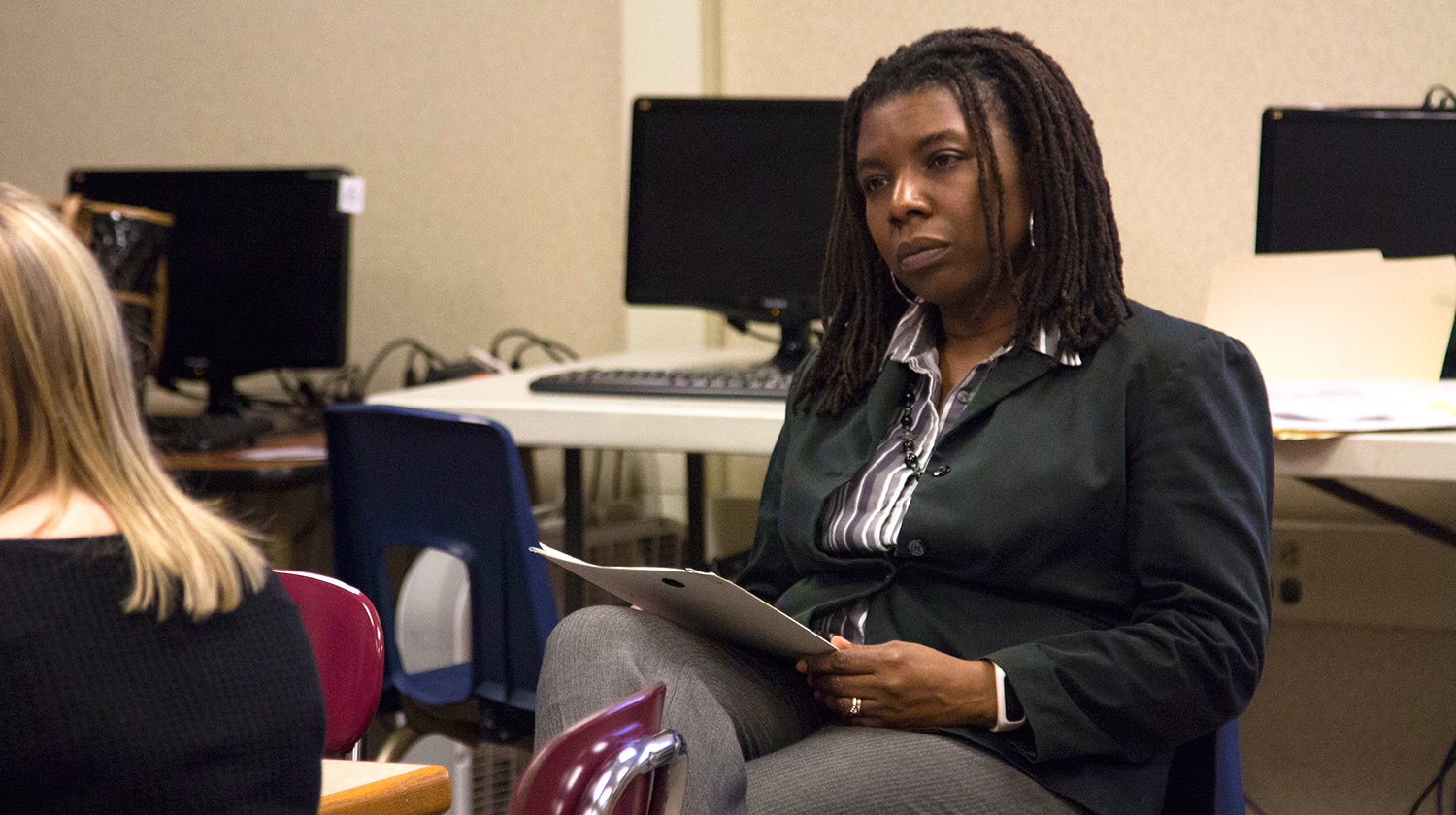 A faculty member working with a student.