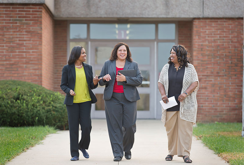 Administration professionals walking together.