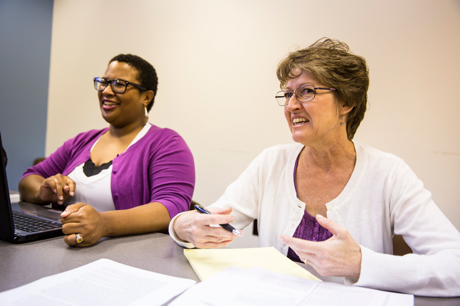 female teacher and student seated