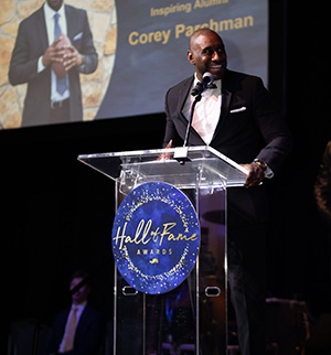 Corey Parchman speaks at a podium during an awards ceremony.