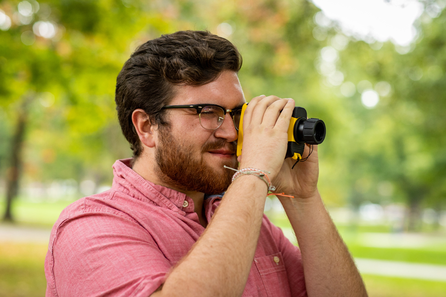 Student with measuring tool