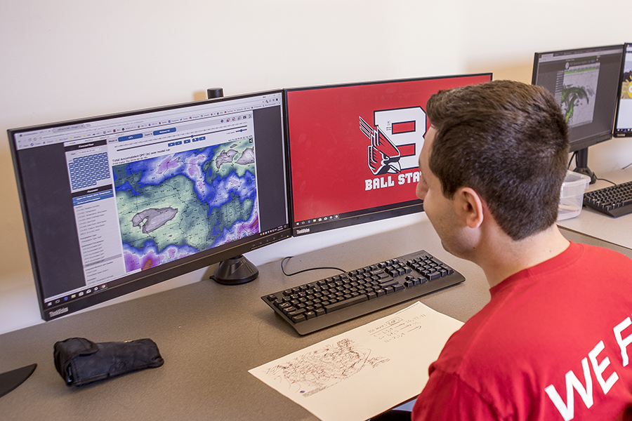 A student uses University software to forecast storms