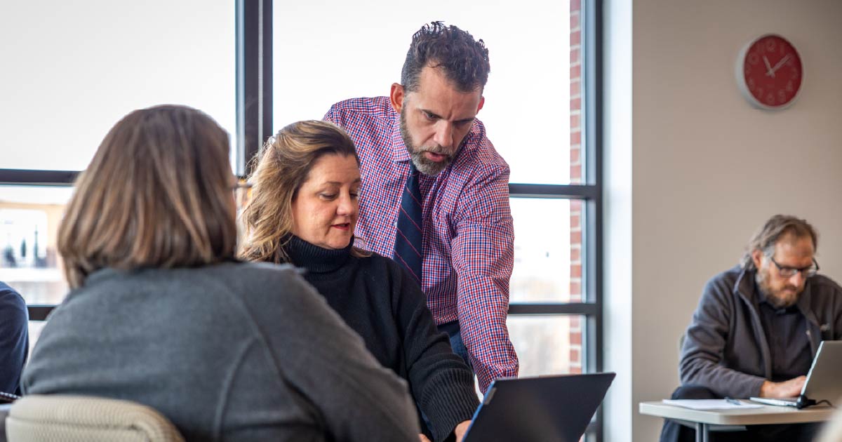 Students meeting in a classroom for the Ball State lifetime learning program.