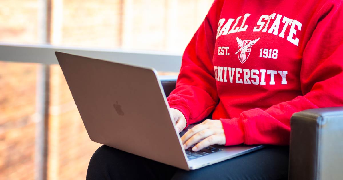 Ball State student working on their laptop.
