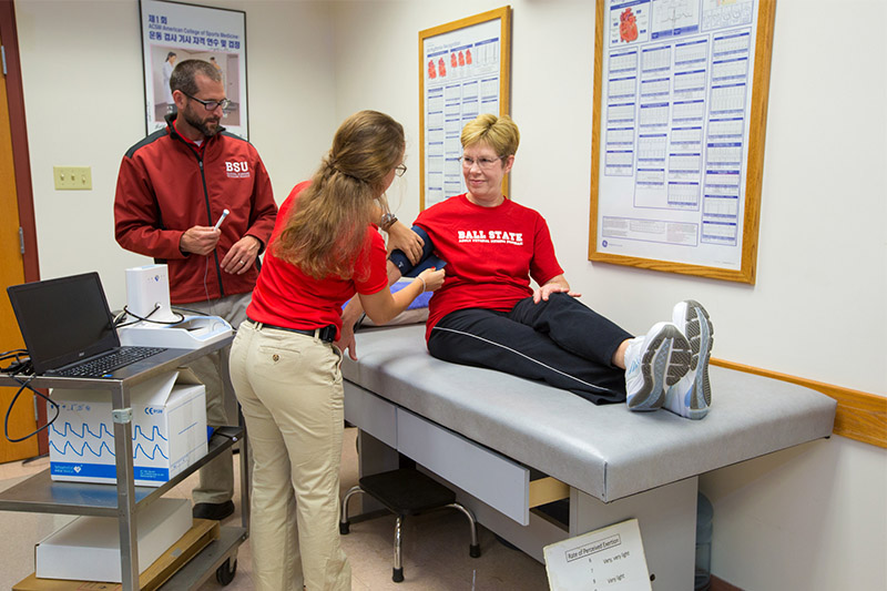 A student works with a patient at the Clinical Procedures lab