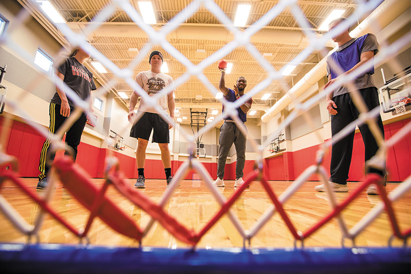 Students play a game with ball.