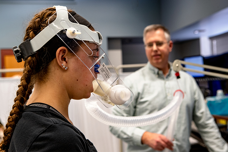 Two Ball State students work at a table