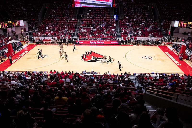 A crowd of Cardinal fans cheer on the basketball team