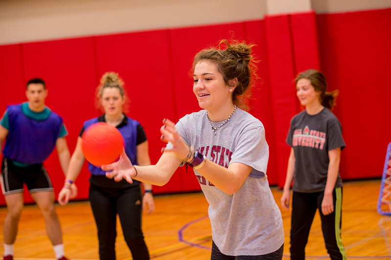 Ball State Kinesiology students play a game with a ball.