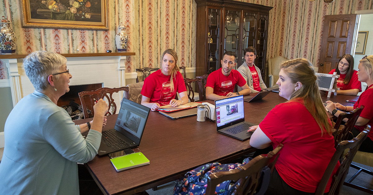 students in dining room of Maplewood Mansion
