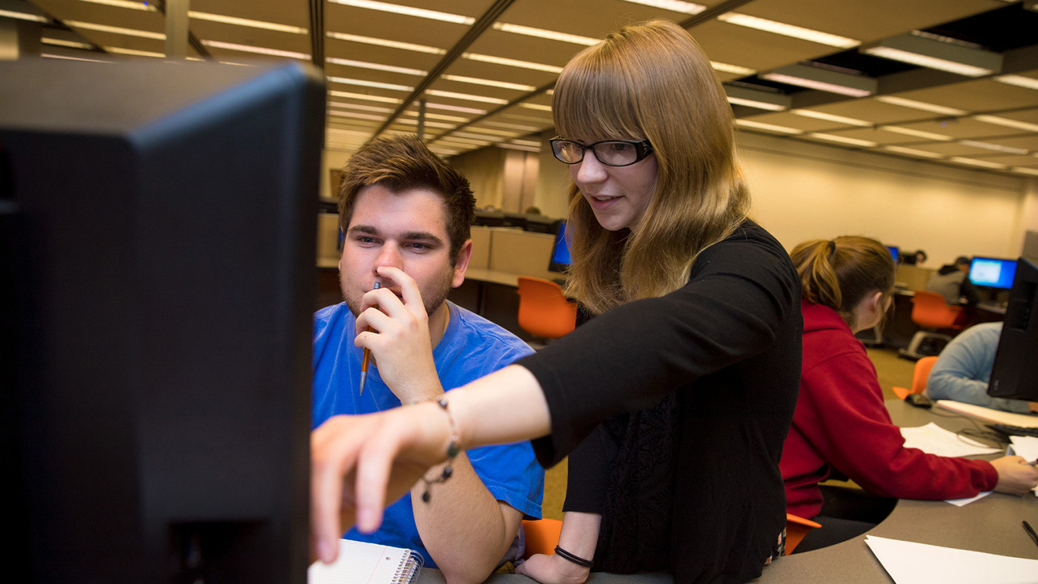Students looking at computer