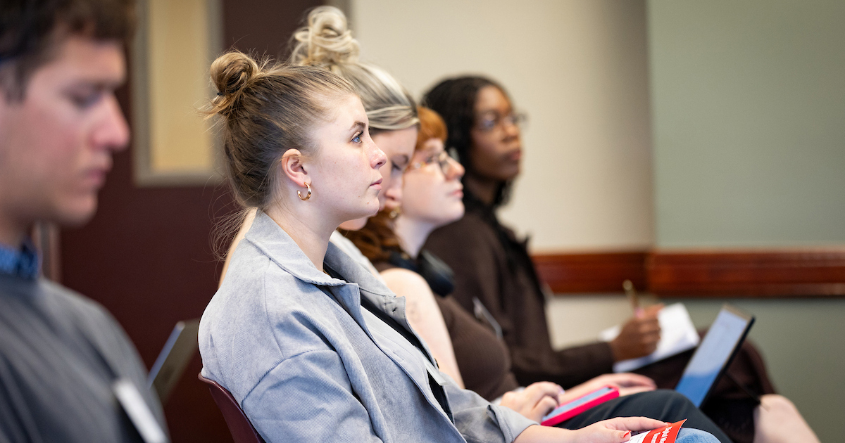 Miller College of Business students sitting and listening to a presentation 