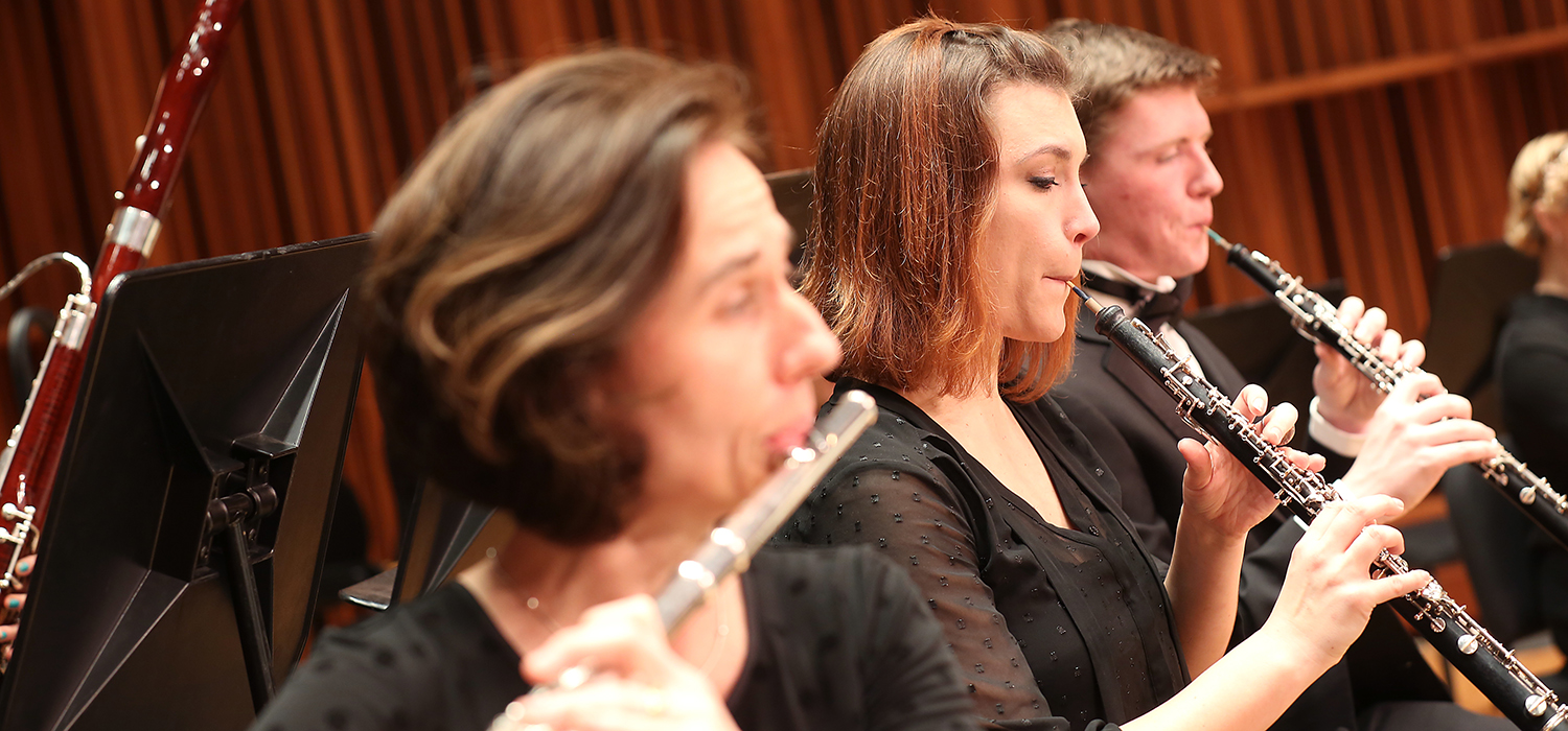 student ensemble playing flute and clarinets