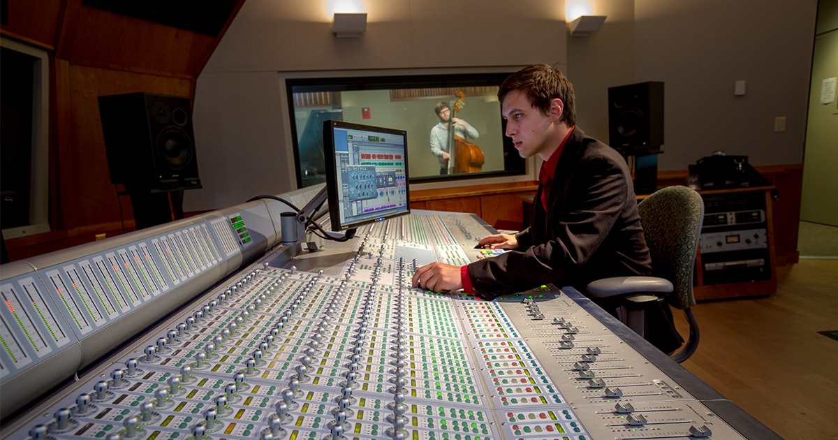 A ball state student working in a studio producing music