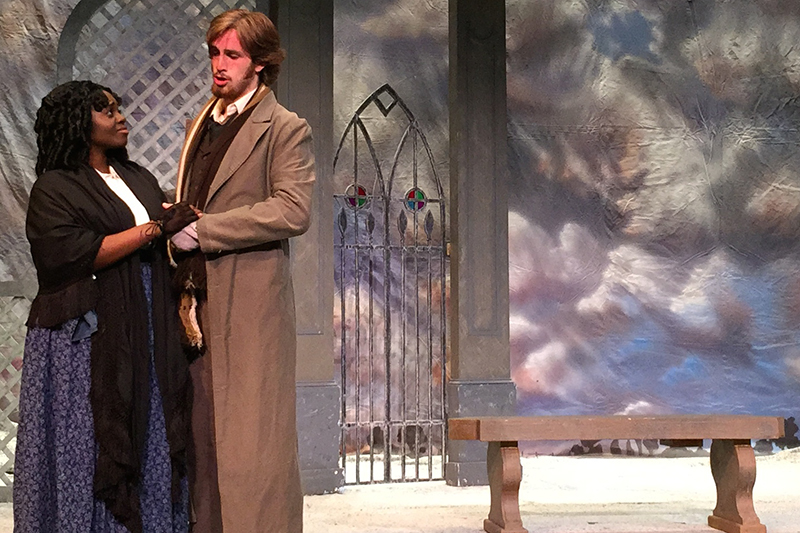 students perform an opera on stage