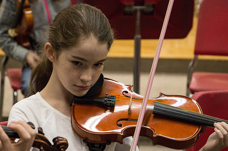 Muncie Symphony Orchestra student playing violin