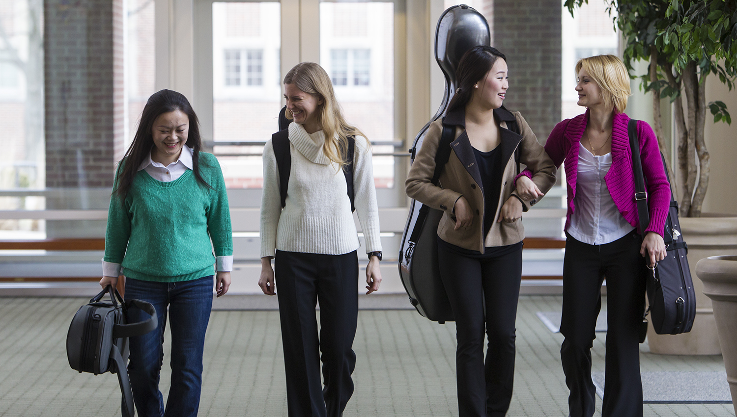 music graduate students walking and talking