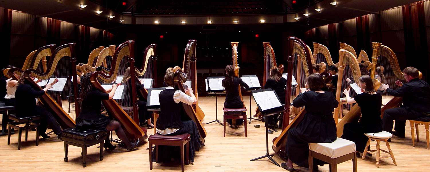 harp ensemble from the rear on stage