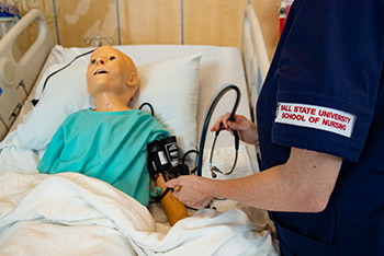 A Nursing student works in a lab