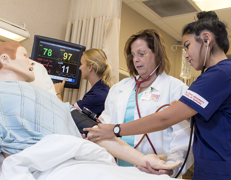 nursing students and instructor in Simulation and Information Technology Center