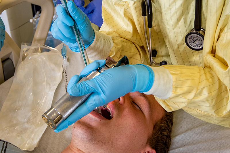Respiratory therapy students working in hospital setting.