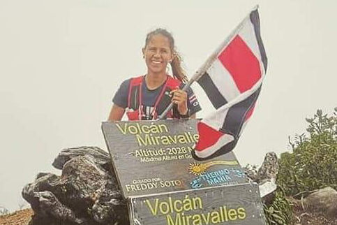 Ashton Keck poses with a flag