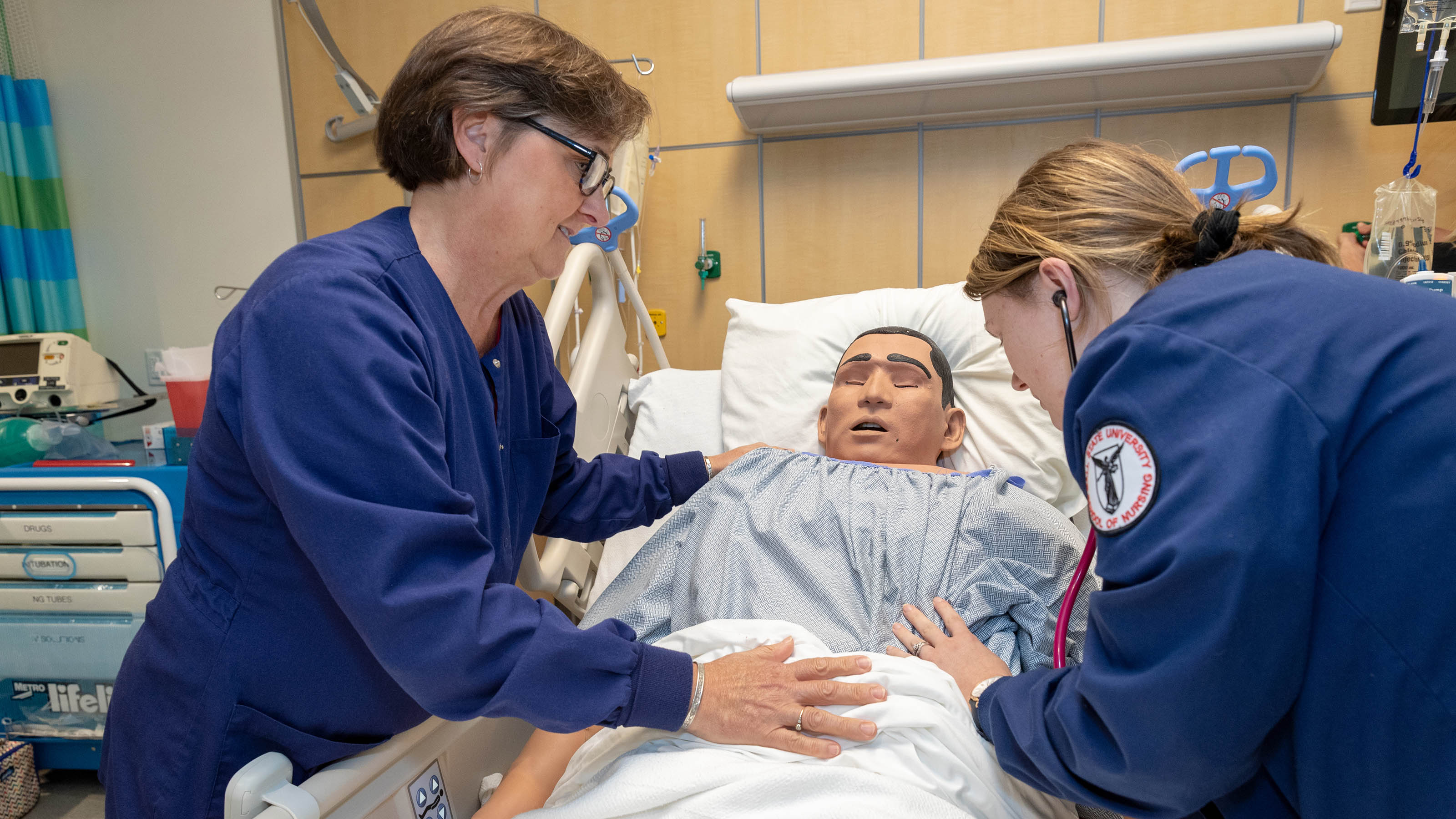 Two female nurses conducting a patient simulation