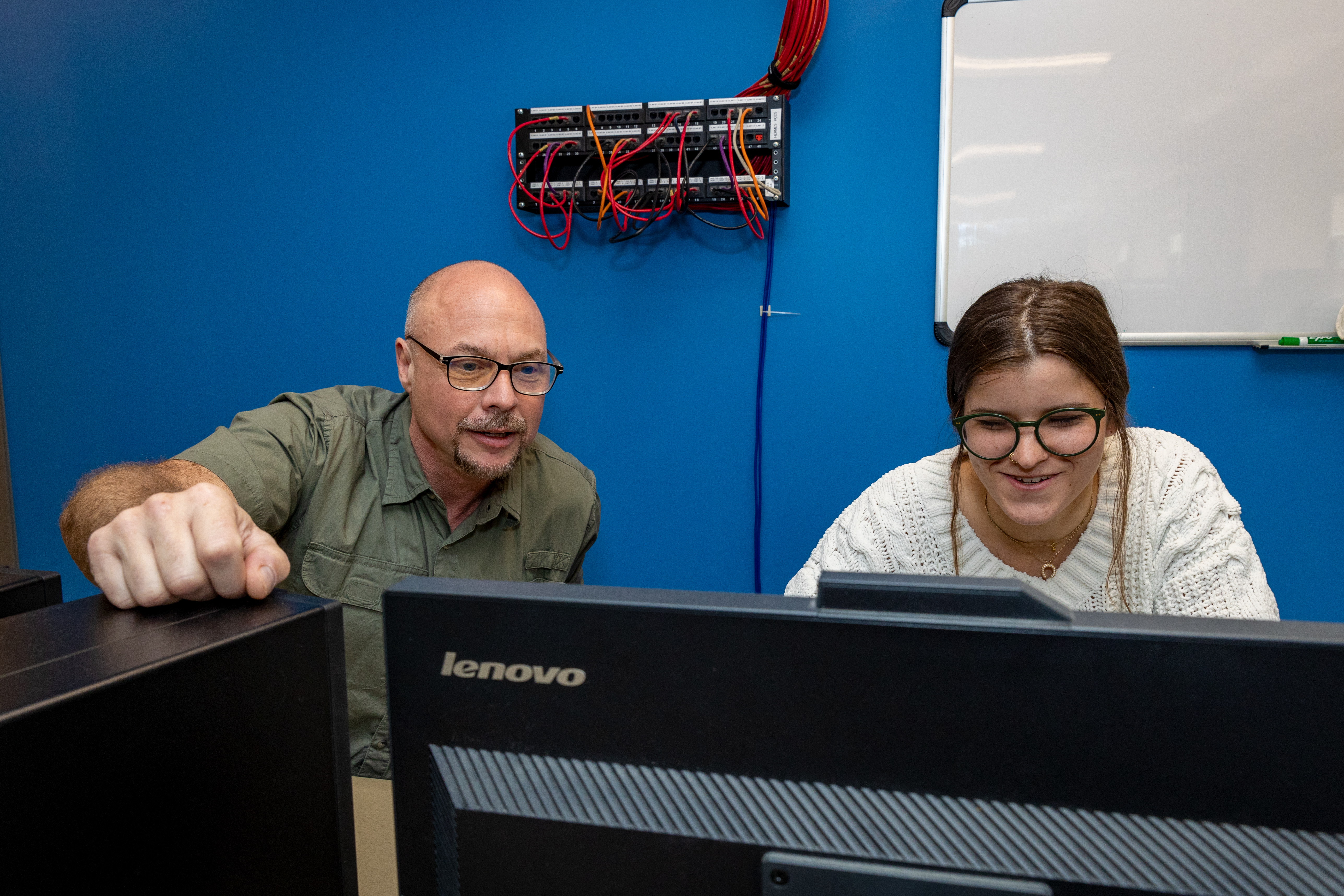 IT bachelor's student Erin Boomershine working with information and communication science faculty Chris Davison in a networking lab in Muncie, Indiana