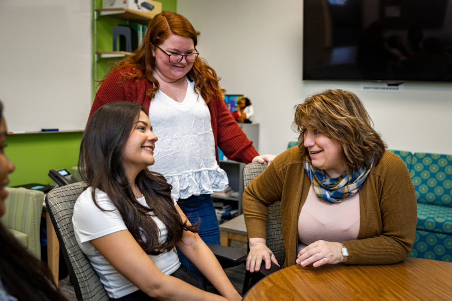 Adrienne Newman speaks with students 