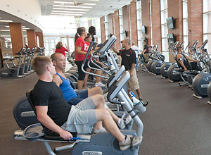 Photo of people using gym equipment