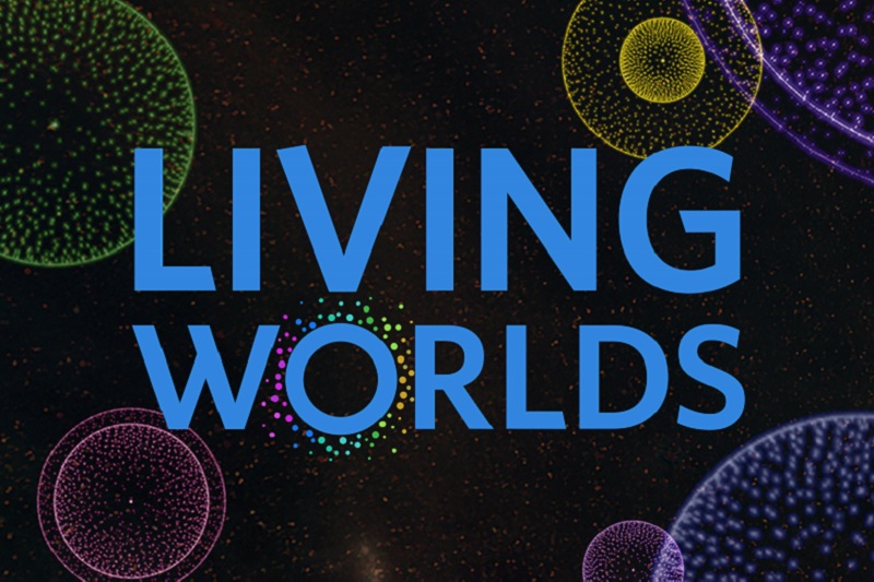 living worlds show poster with colorful orbs in space
